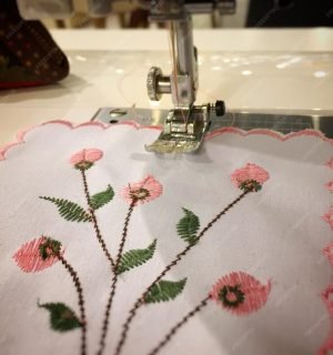 close-up-floral-pattern-napkin-sewing-machine_1048944-11055869